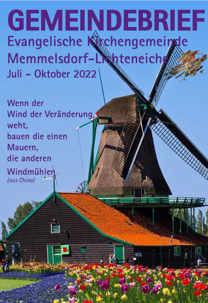 Windmühle, davor blühende Tulpen